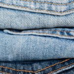 Quality Clothes - Stack of blue jeans arranged by color