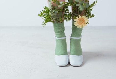 Eco-Friendly Shoes - Leaves and a Flower on a Person's Socks