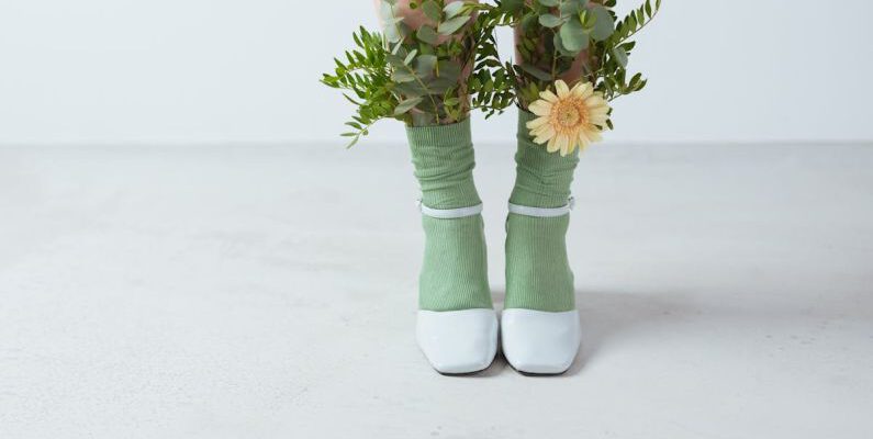 Eco-Friendly Shoes - Leaves and a Flower on a Person's Socks