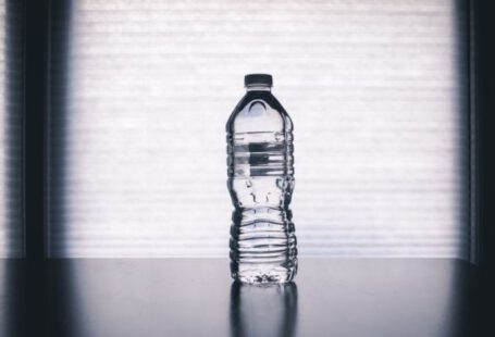 Water Bottle - Clear Disposable Bottle on Black Surface