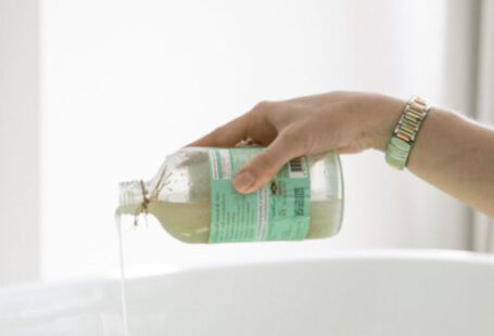 Skincare - Person Pouring Aromatic Soap On Water
