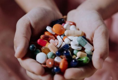 Kids’ Tablets - A Handful of Assorted Medicines on a Child's Hands